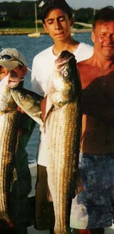 boys with their bluefish and striper!